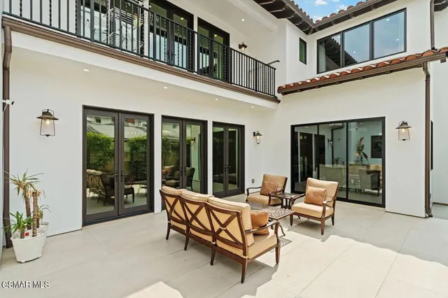 a view of a backyard with swimming pool