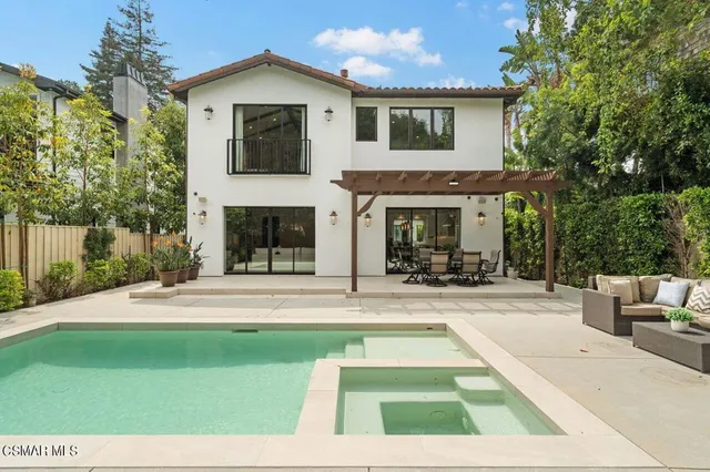 a view of a yard with trees in front of it