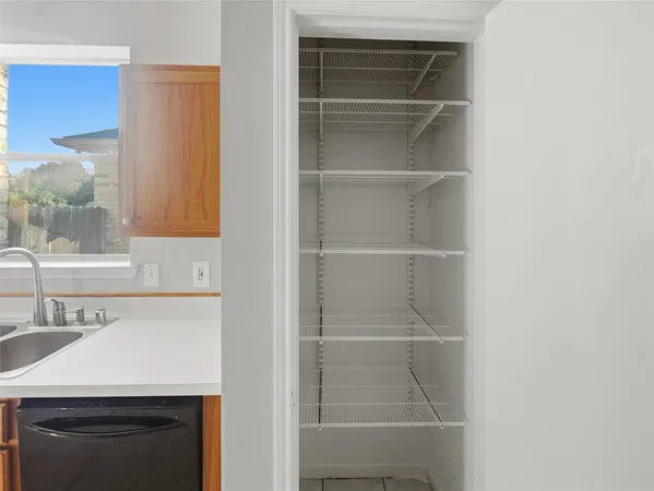 a room with a sink and a washer dryer
