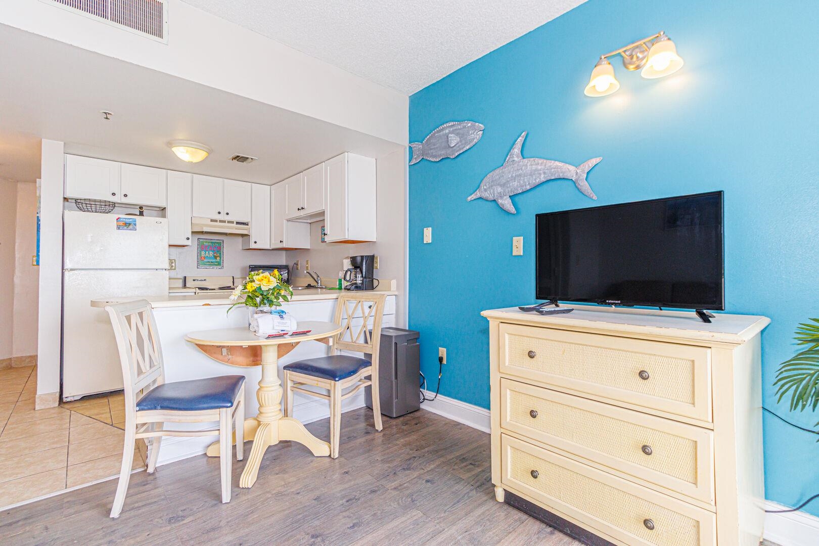 1605 South Ocean Boulevard, Unit 505 Myrtle Beach, SC 29577 - Photo 12 of 38 Dining space featuring light wood-style floors and a textured ceiling