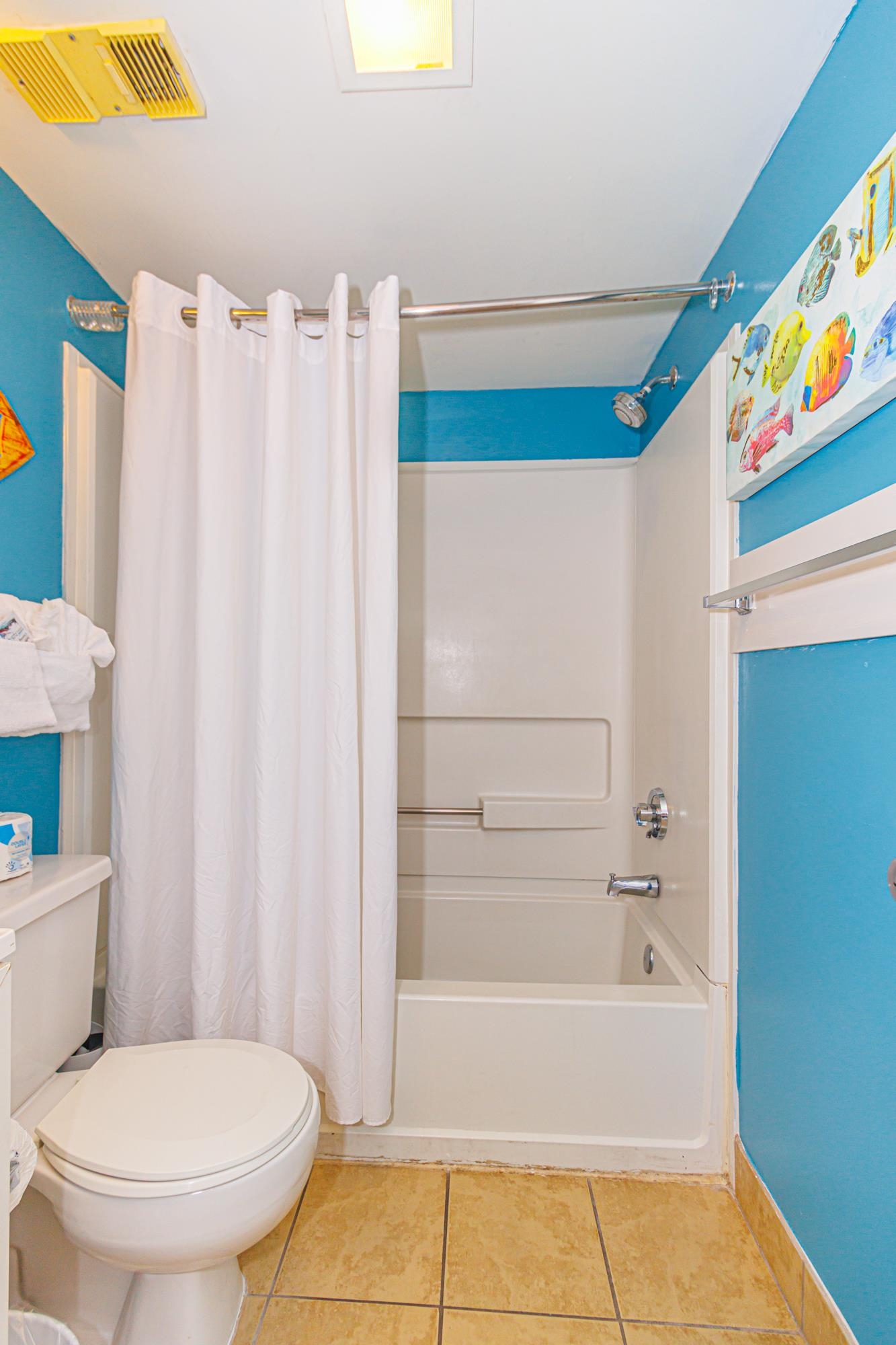 1605 South Ocean Boulevard, Unit 505 Myrtle Beach, SC 29577 - Photo 23 of 38 Bathroom featuring shower / bathtub combination with curtain and light tile patterned floors