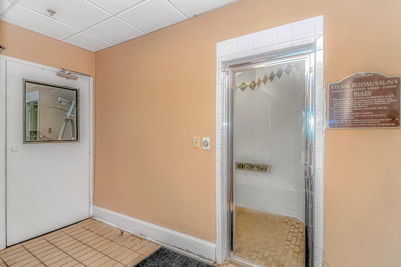 1605 South Ocean Boulevard, Unit 505 Myrtle Beach, SC 29577 - Photo 34 of 38 Bathroom featuring a stall shower, tile patterned floors, and a paneled ceiling