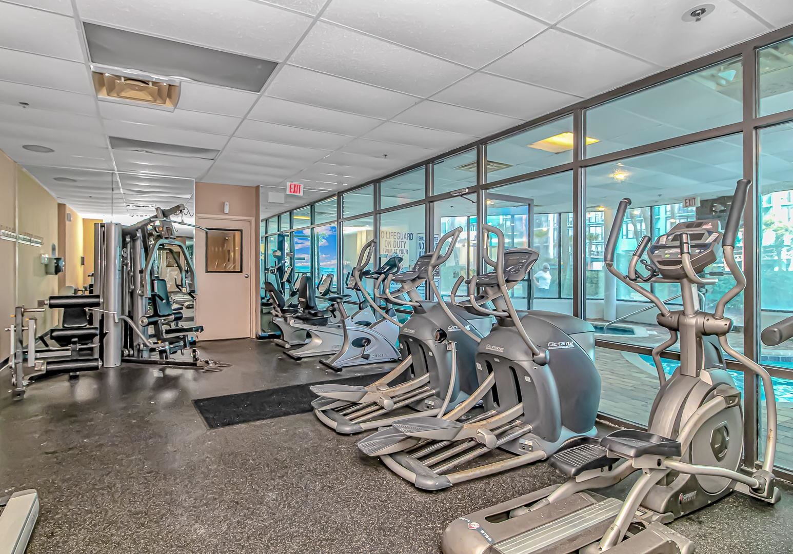 1605 South Ocean Boulevard, Unit 505 Myrtle Beach, SC 29577 - Photo 37 of 38 Gym with a drop ceiling and a wall of windows