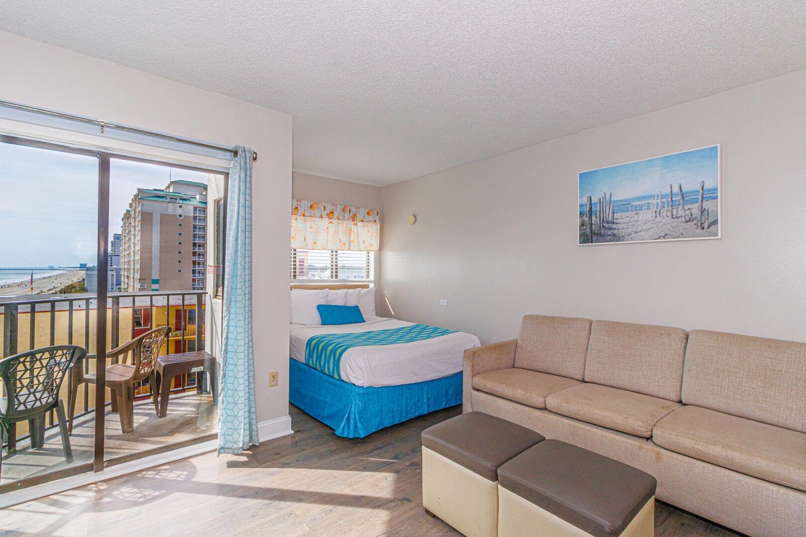 1605 South Ocean Boulevard, Unit 505 Myrtle Beach, SC 29577 - Photo 9 of 38 Bedroom with wood finished floors, a textured ceiling, and access to exterior