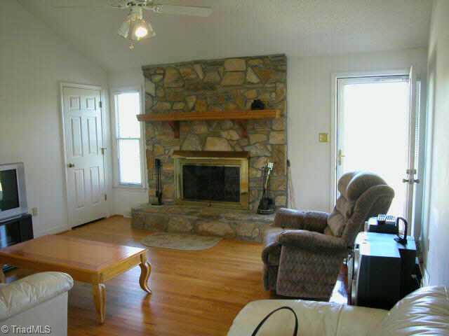 1141 Curt Boyles Road King, NC 27021 - Photo 4 of 9 Other. Great room w/HW floors, cath ceil & rock FP