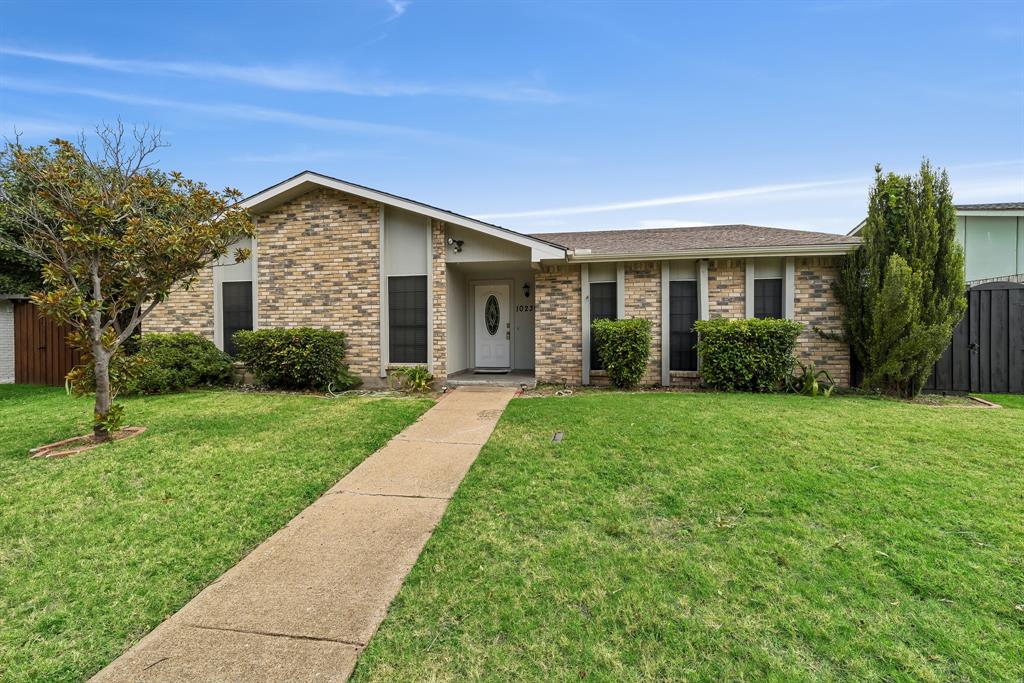 10239 Green Ash Road Dallas, TX 75243 - Photo 1 of 36 Brick facade with light-toned siding accents