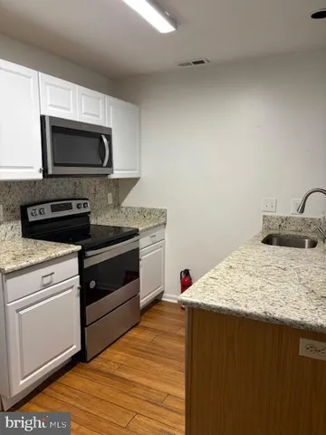 a kitchen with a stove and a microwave