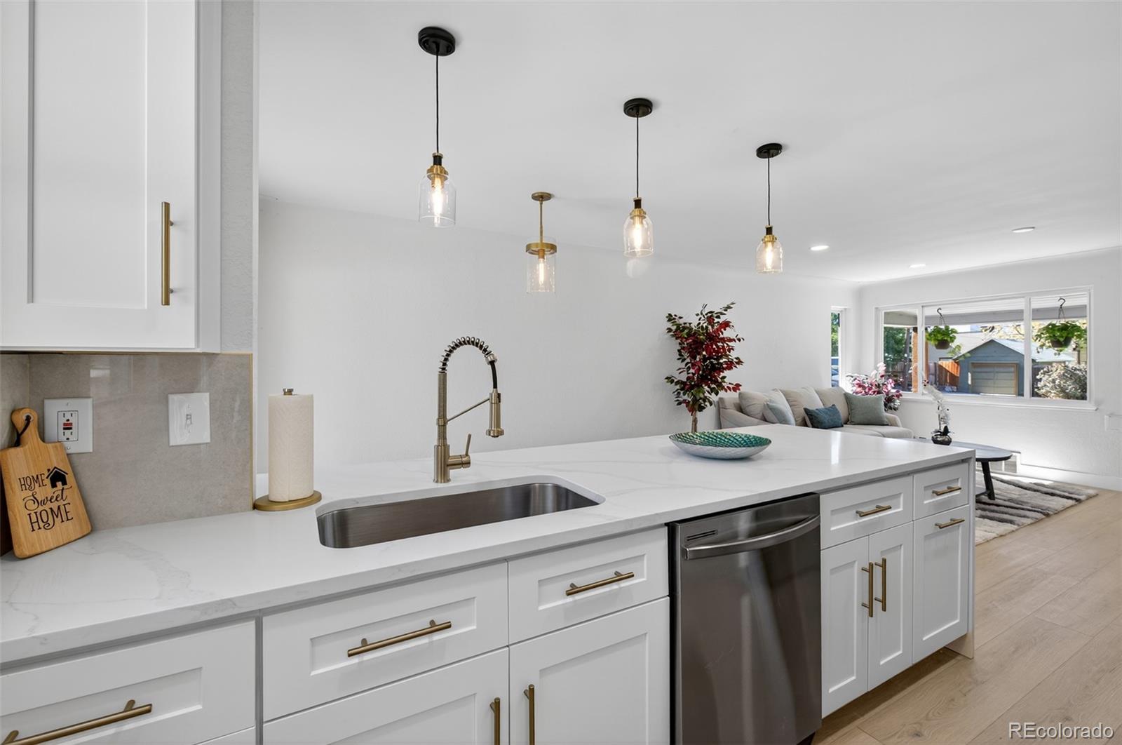 1856 South Steele Street Denver, CO 80210 - Photo 11 of 34 a kitchen with a sink and cabinets