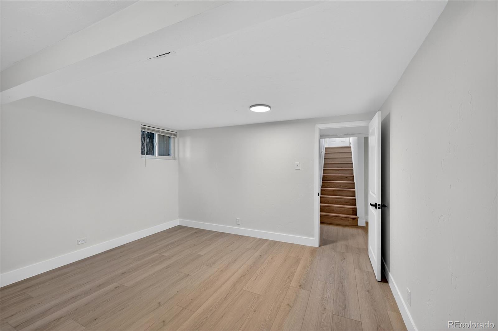 1856 South Steele Street Denver, CO 80210 - Photo 25 of 34 wooden floor in an empty room