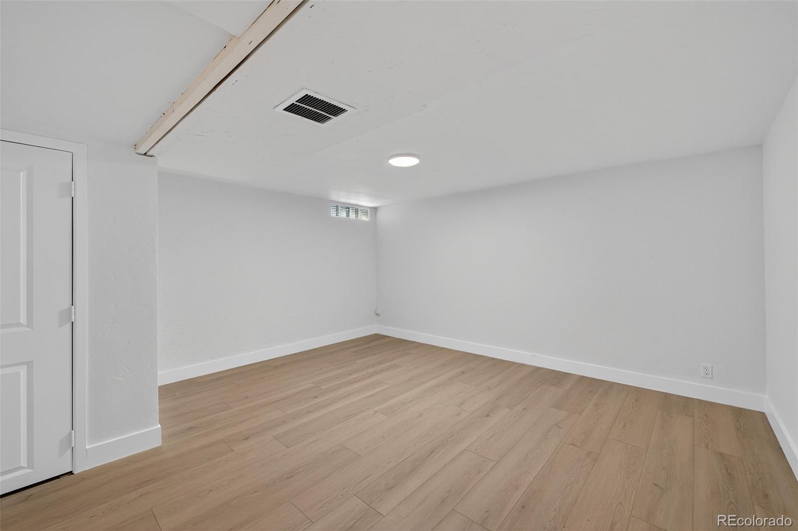1856 South Steele Street Denver, CO 80210 - Photo 27 of 34 wooden floor in an empty room