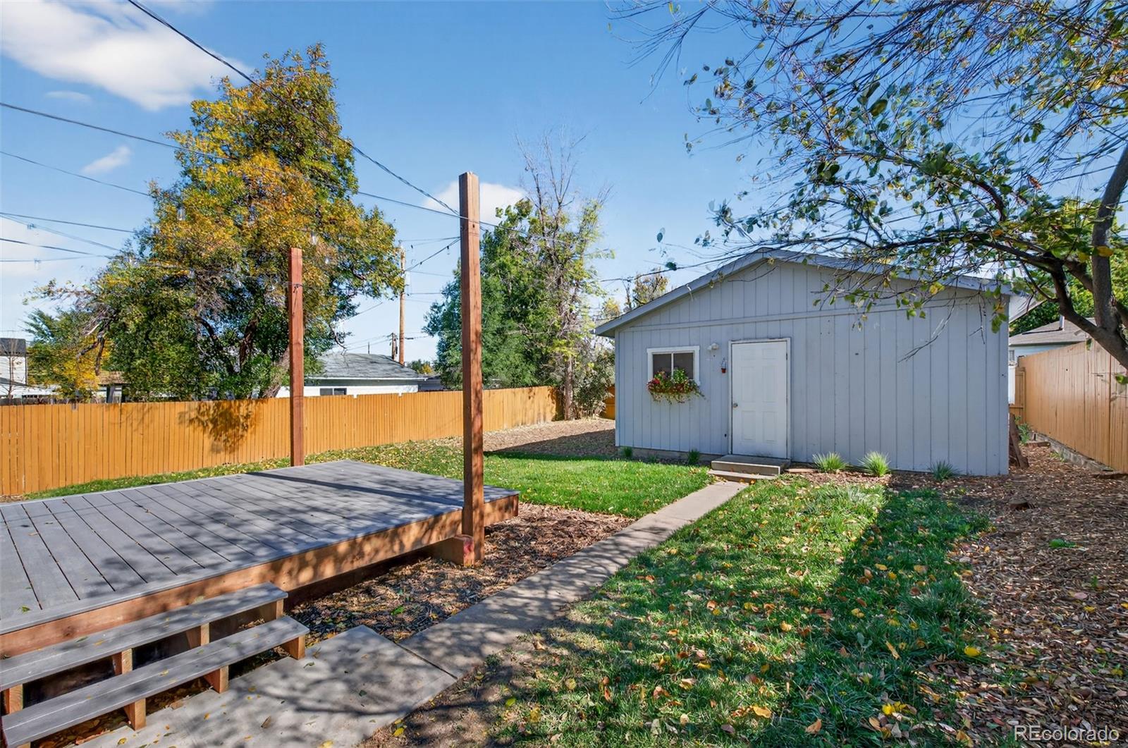 1856 South Steele Street Denver, CO 80210 - Photo 29 of 34 a view of a house with a yard and tree