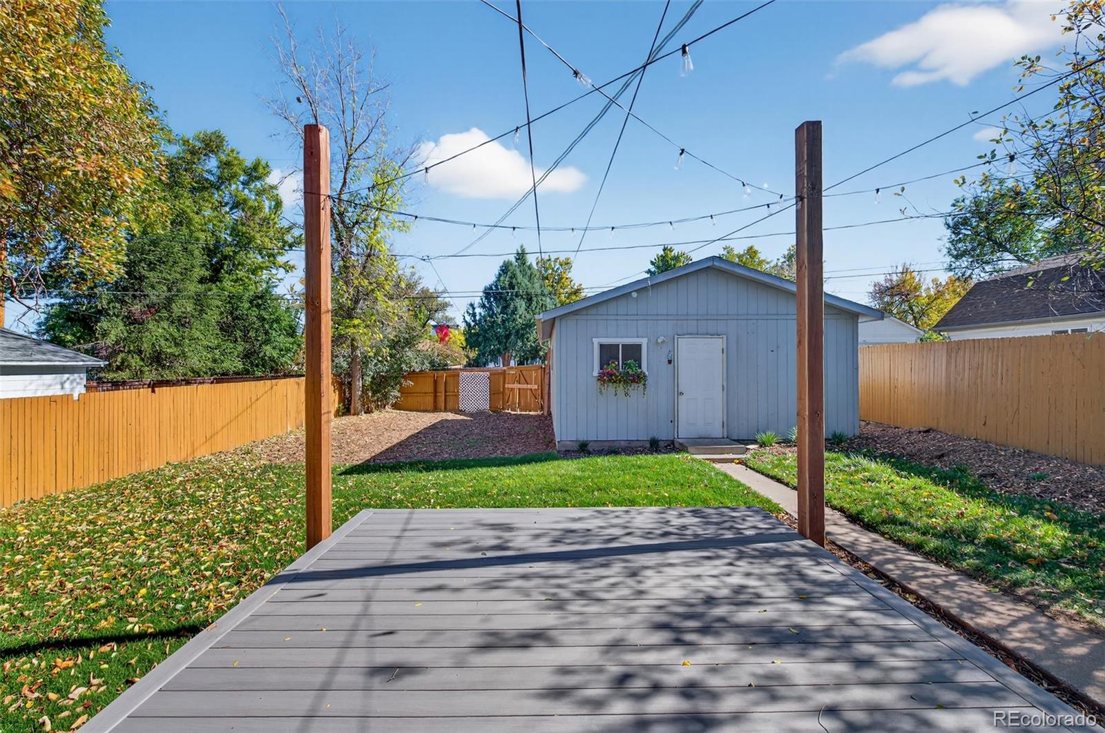 1856 South Steele Street Denver, CO 80210 - Photo 30 of 34 a front view of a house with garden