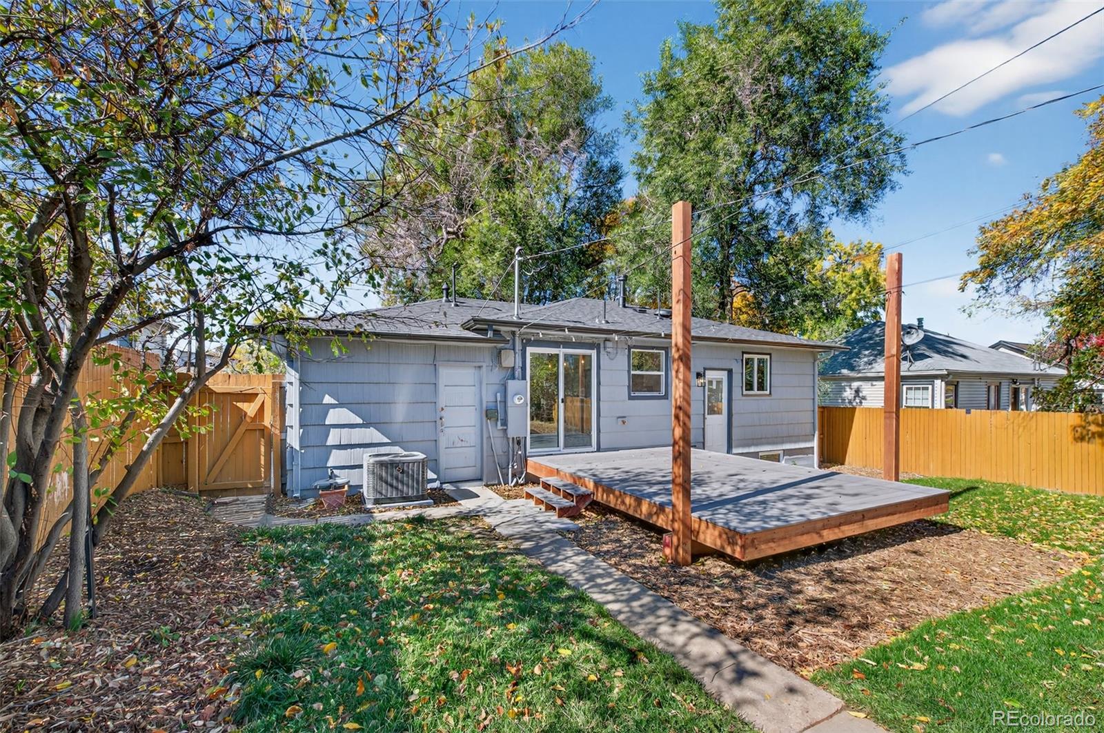 1856 South Steele Street Denver, CO 80210 - Photo 31 of 34 a front view of a house with garden