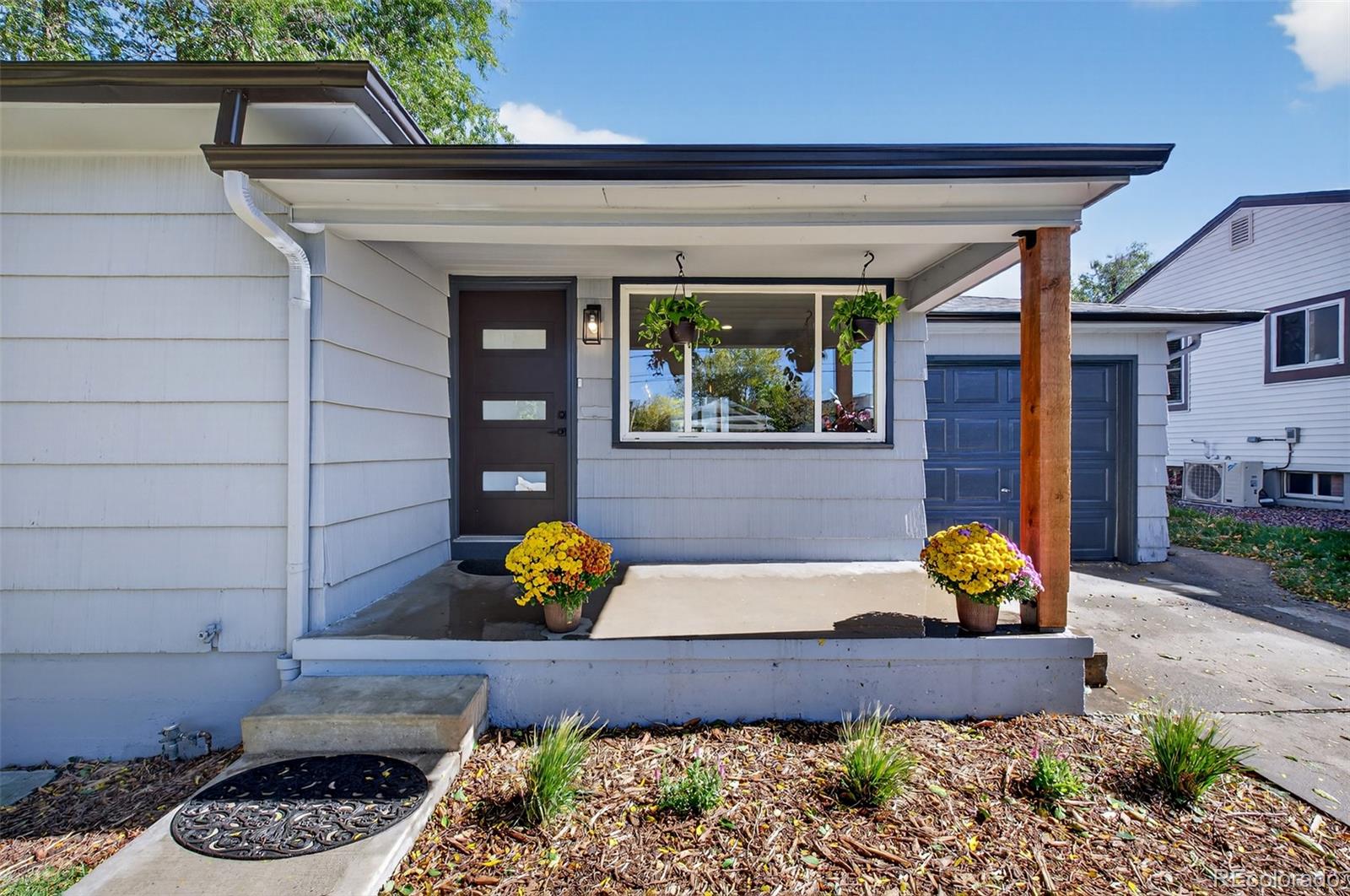 1856 South Steele Street Denver, CO 80210 - Photo 4 of 34 a front view of a house with outdoor seating