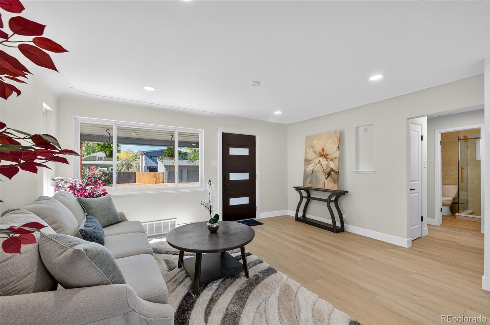 1856 South Steele Street Denver, CO 80210 - Photo 8 of 34 a living room with furniture and wooden floor