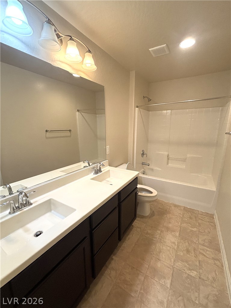 121 Elm Reed Avenue Las Vegas, NV 89113 - Photo 23 of 30 Double vanities and a spacious tub/shower combination elevate this functional bathroom.
