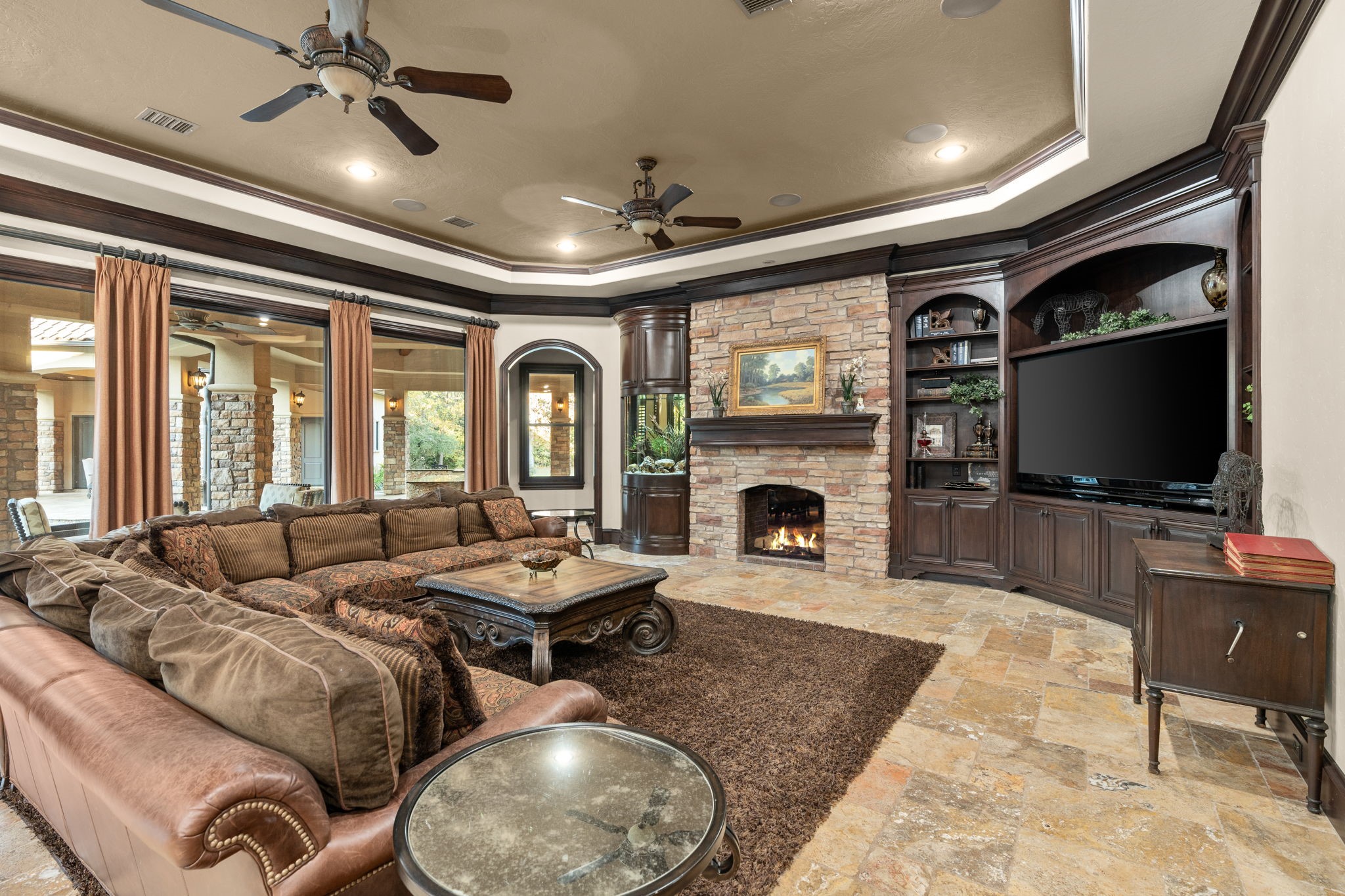 7918 Red Bay Circle Magnolia, TX 77354 - Photo 13 of 50 a living room with furniture fireplace and a flat screen tv