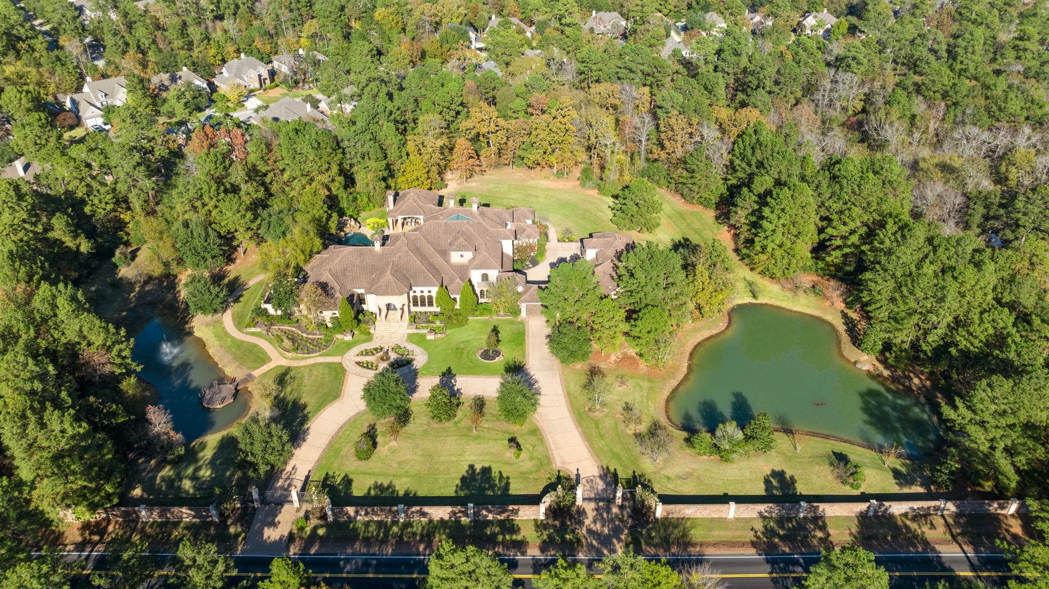 7918 Red Bay Circle Magnolia, TX 77354 - Photo 2 of 50 an aerial view of a residential houses with yard and swimming pool