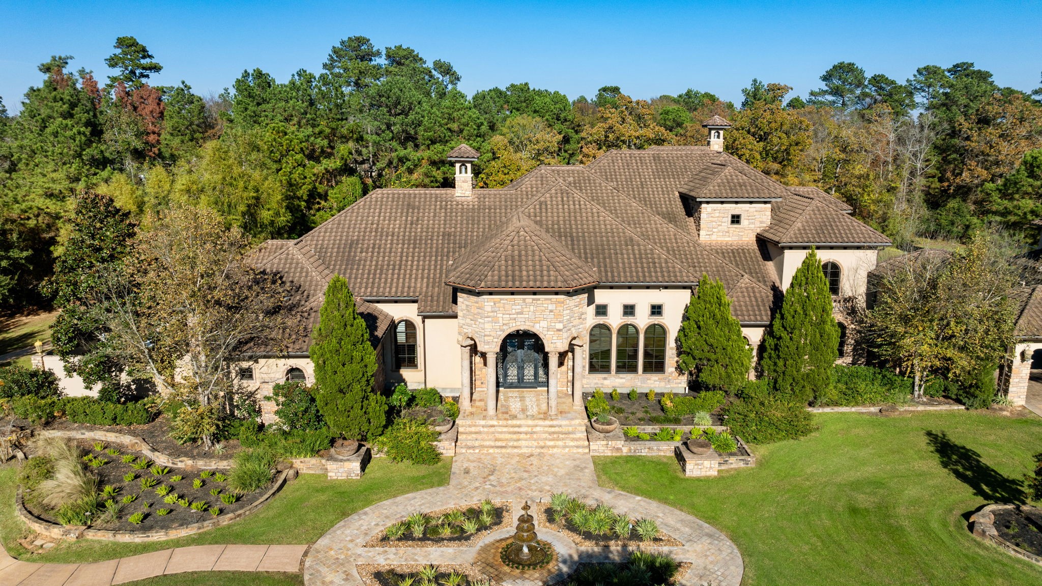 7918 Red Bay Circle Magnolia, TX 77354 - Photo 4 of 50 an aerial view of a house with garden space and trees all around