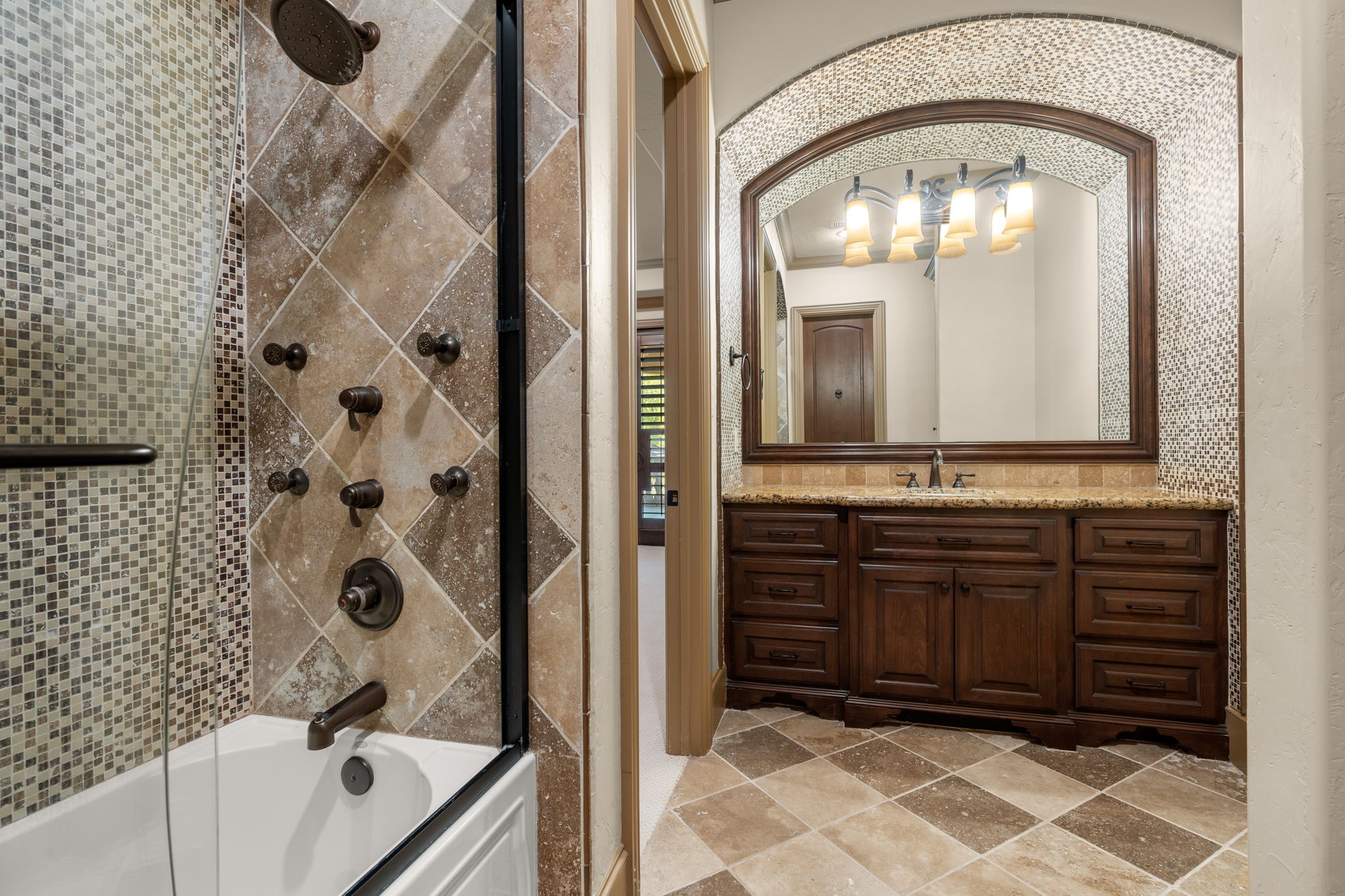 7918 Red Bay Circle Magnolia, TX 77354 - Photo 42 of 50 a bathroom with a tub sink and mirror