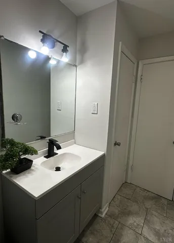 a bathroom with a toilet and a shower curtain
