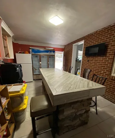 a metallic refrigerator freezer sitting in a kitchen