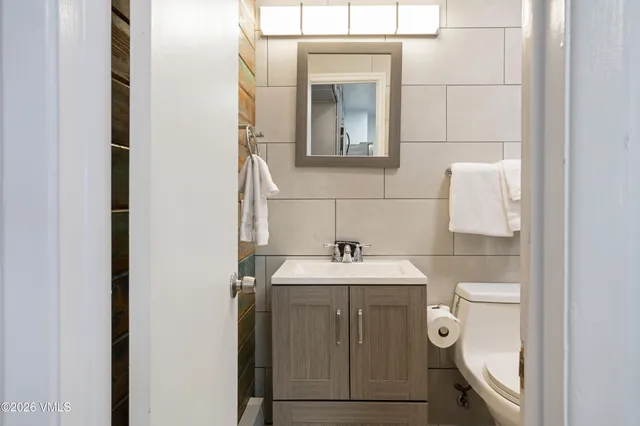 a bathroom with a sink and mirror