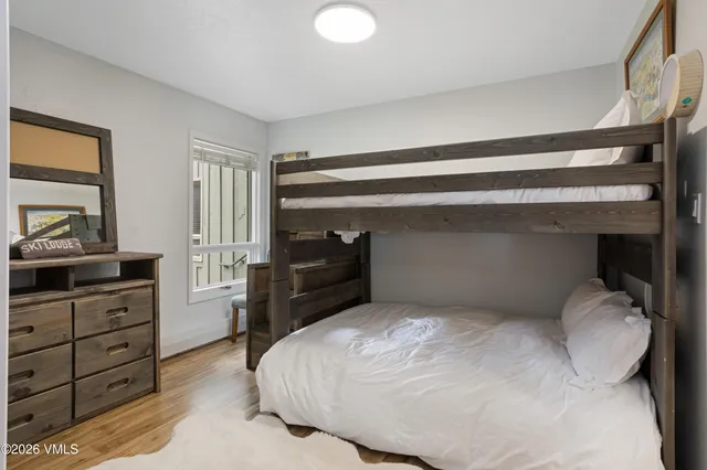 a bedroom with a bed and dresser