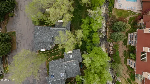 an aerial view of a house with a yard