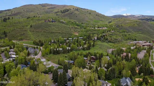 a view of a town with mountains in the background