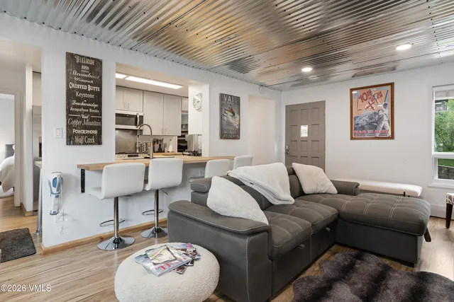 a living room with furniture and a table