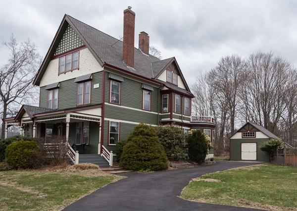 187 Pleasant Street Framingham, MA 01701 - Photo 1 of 39 a front view of a house with a yard