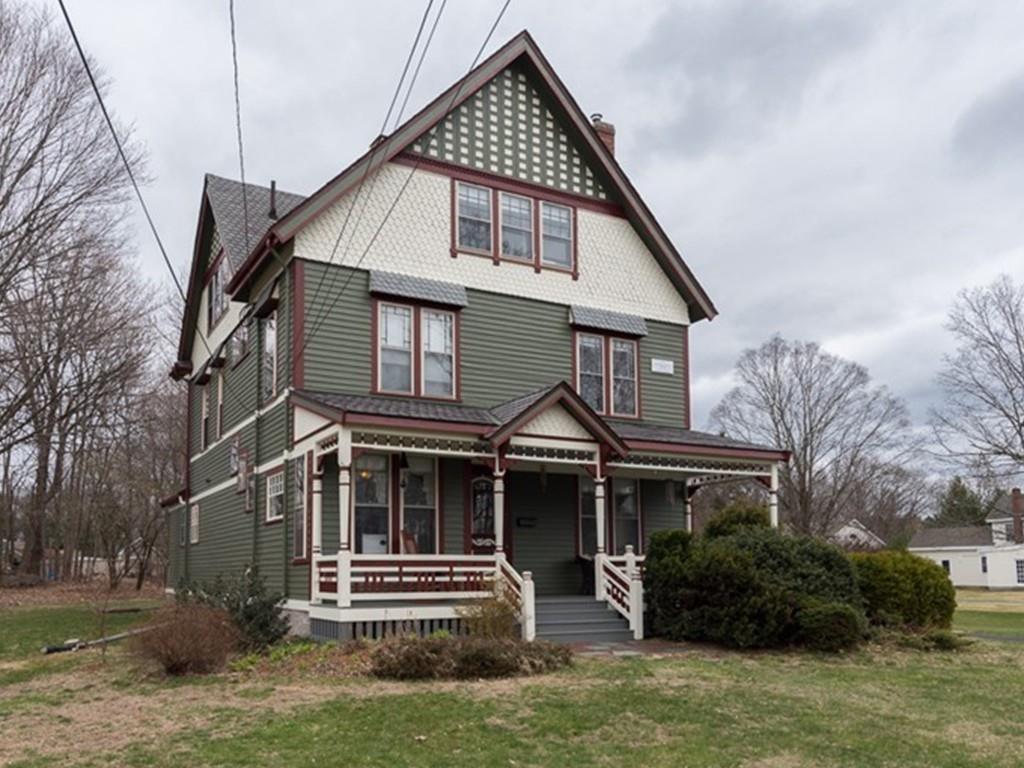 187 Pleasant Street Framingham, MA 01701 - Photo 2 of 39 a front view of a house with a yard