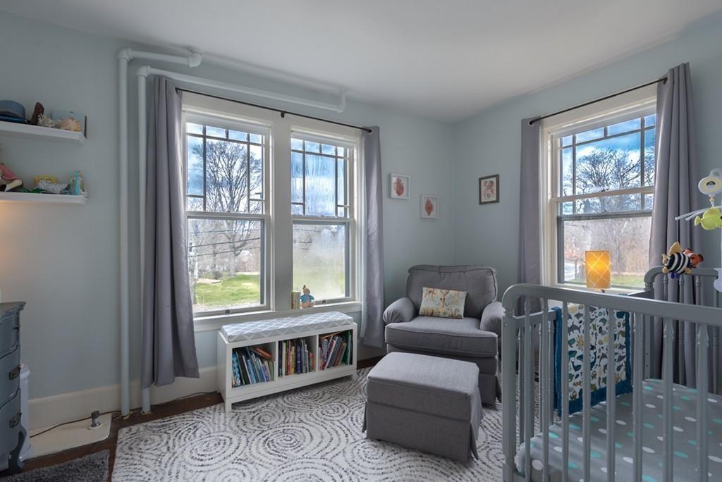 187 Pleasant Street Framingham, MA 01701 - Photo 22 of 39 a living room with furniture and a window