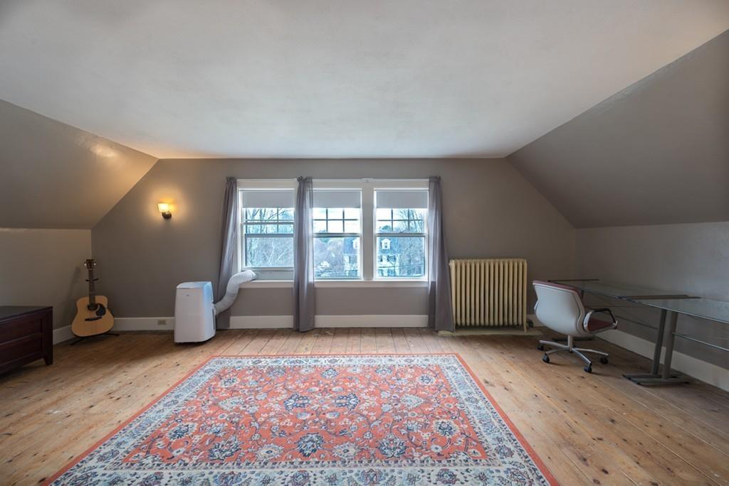 187 Pleasant Street Framingham, MA 01701 - Photo 29 of 39 a bedroom with furniture and a window