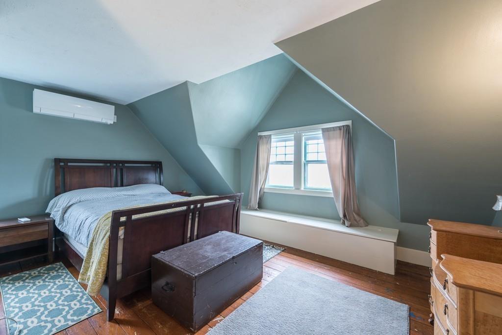 187 Pleasant Street Framingham, MA 01701 - Photo 30 of 39 a bedroom with a bed and window