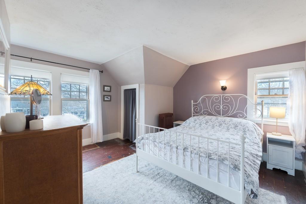 187 Pleasant Street Framingham, MA 01701 - Photo 31 of 39 a bedroom with a large bed and a dresser