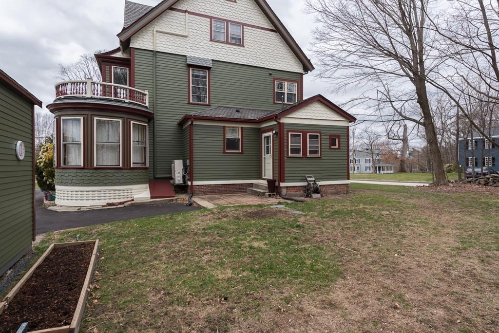 187 Pleasant Street Framingham, MA 01701 - Photo 36 of 39 a front view of a house with a yard