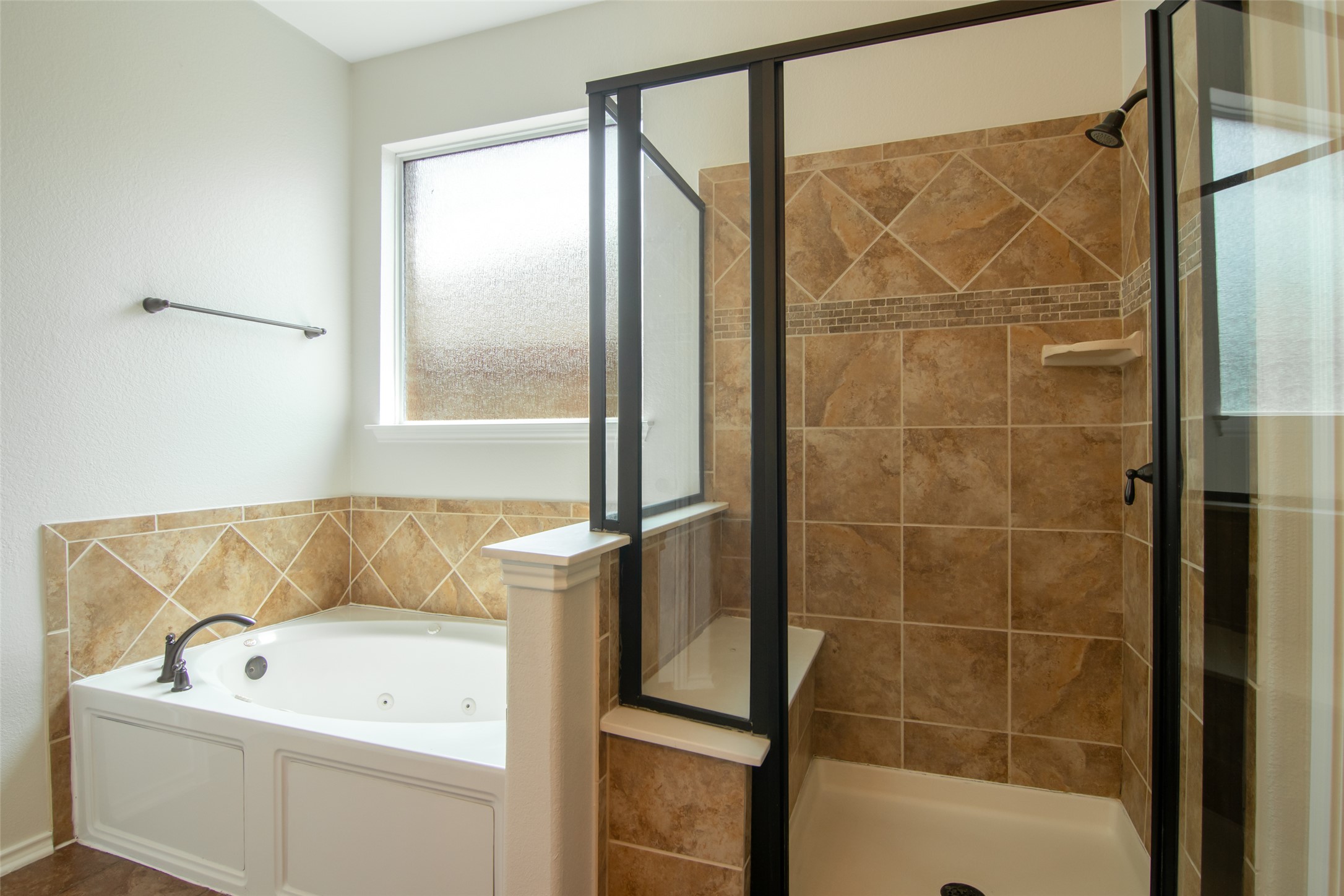 12104 Broten Street Austin, TX 78748 - Photo 19 of 32 Relax in the deep soaking tub or step into the tiled walk-in shower.
