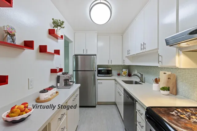 a kitchen with a white stove top oven and refrigerator