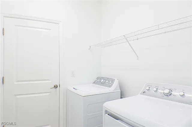 a utility room with dryer and washer