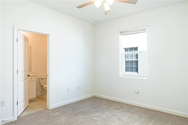 an empty room with a empty space and windows