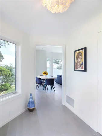a dining room with furniture and a chandelier