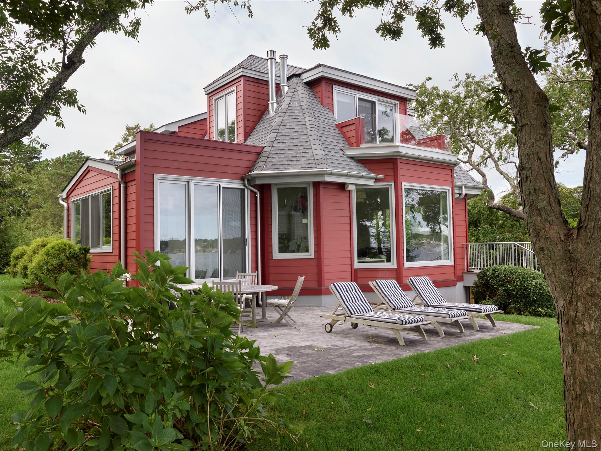 2 Sun Court Hampton Bays, NY 11946 - Photo 20 of 35 a front view of a house with garden and porch