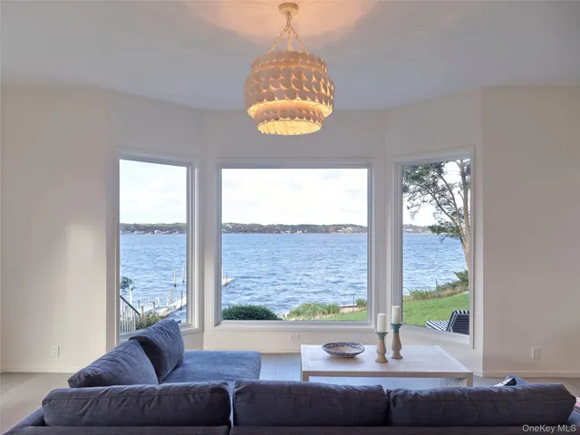 a living room with couch and a large window