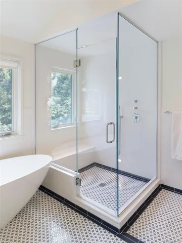 a bathroom with a shower and a bathtub