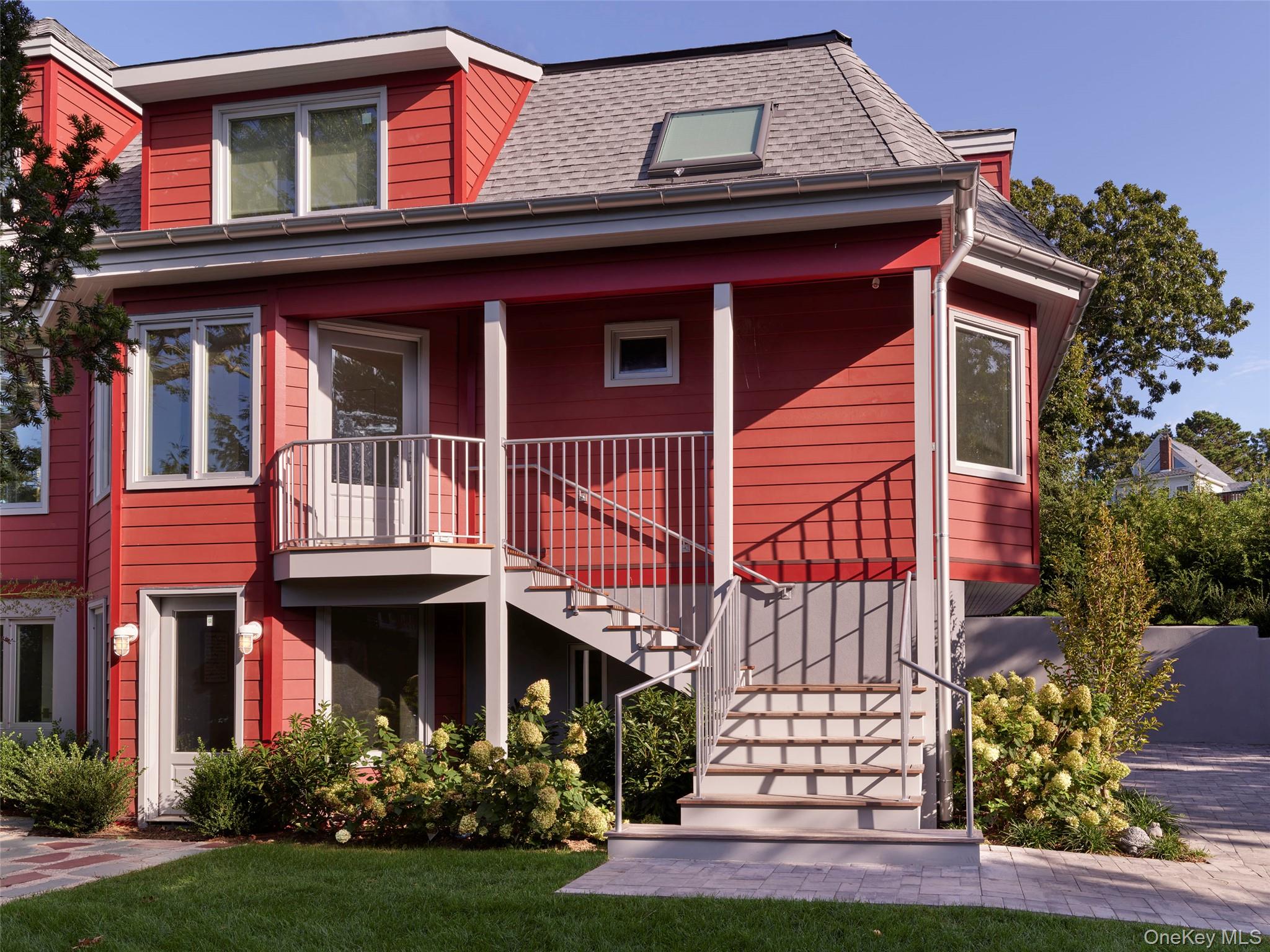 2 Sun Court Hampton Bays, NY 11946 - Photo 30 of 35 a view of a house with a garden