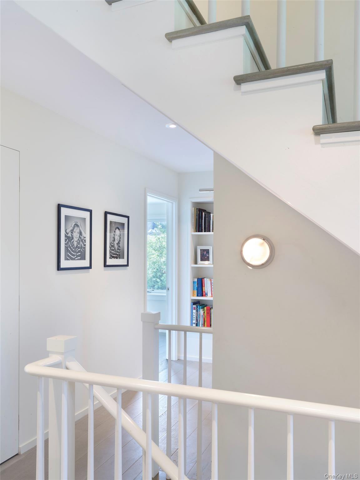 2 Sun Court Hampton Bays, NY 11946 - Photo 32 of 35 a view of a hallway with windows