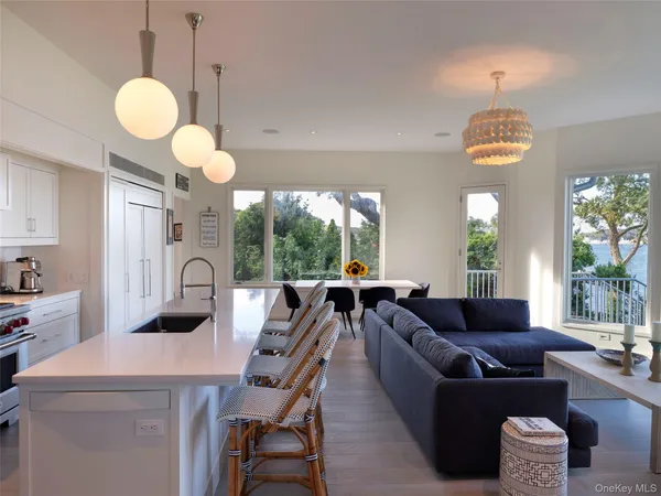 a view of a dining room with furniture wooden floor and chandelier