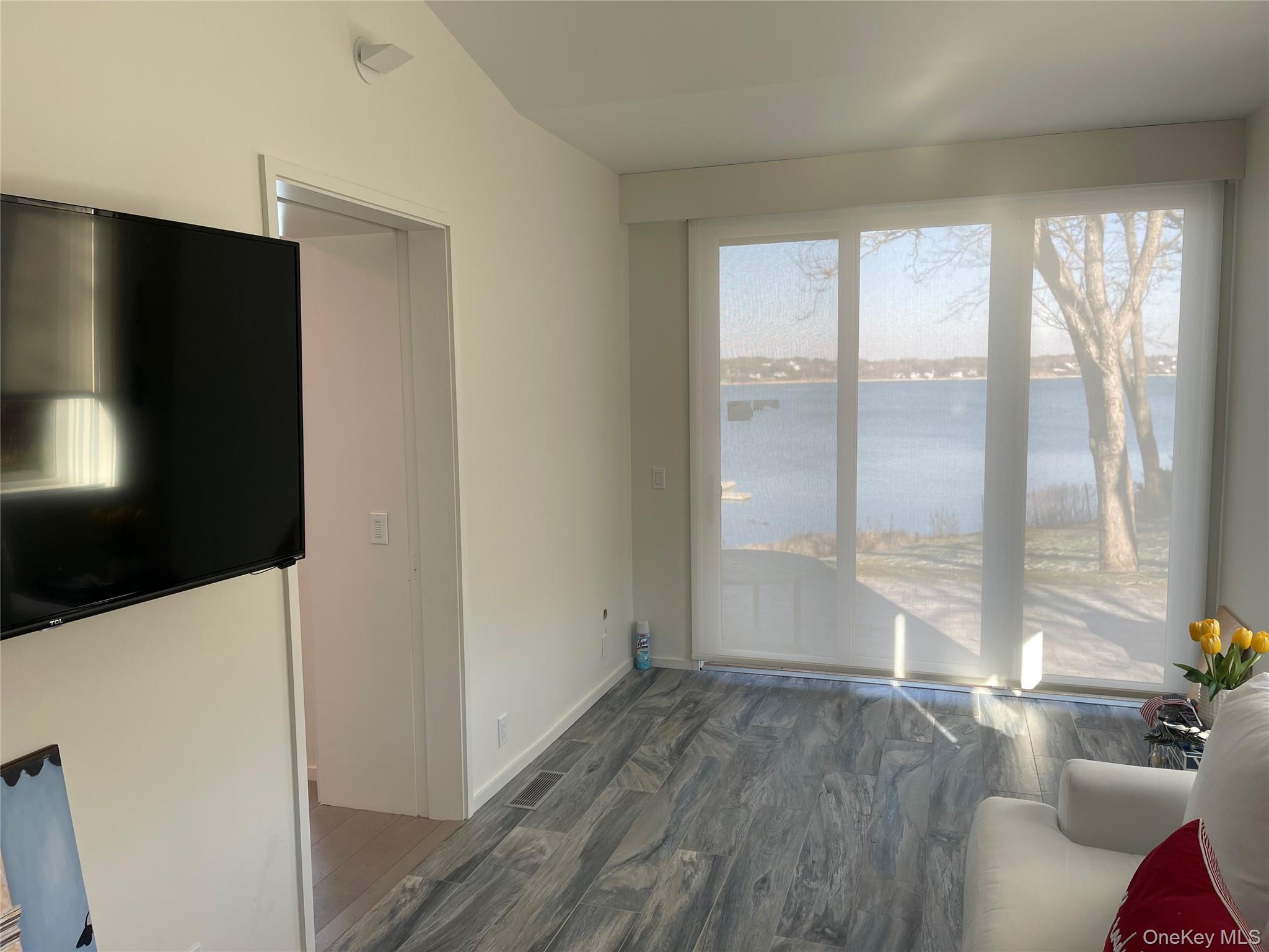 2 Sun Court Hampton Bays, NY 11946 - Photo 8 of 35 a view of livingroom with hardwood floor and window